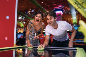 Arcade1 Two adults playing air hockey